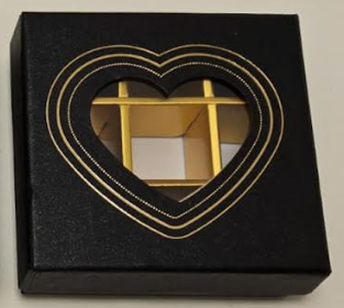 Black Chocolate box divided into 9, with a transparent window in a heart Shape