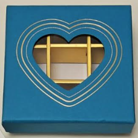 Blue Chocolate box divided into 9 with a transparent window in a heart pattern