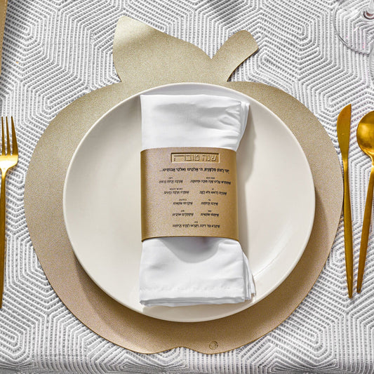 Leather Simanim Napkin Wraps on a white plate and gold apple charger | Waterdale Collection
