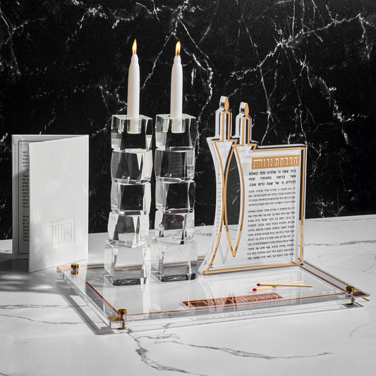 Classic 2.0 Hadlokas Neiros Sculpture and Candlesticks on top of a board