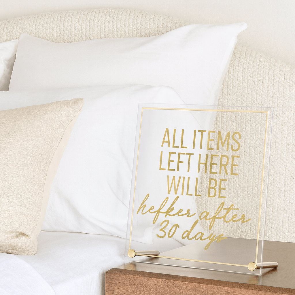 Guest Room Sign displayed on a bedside table.