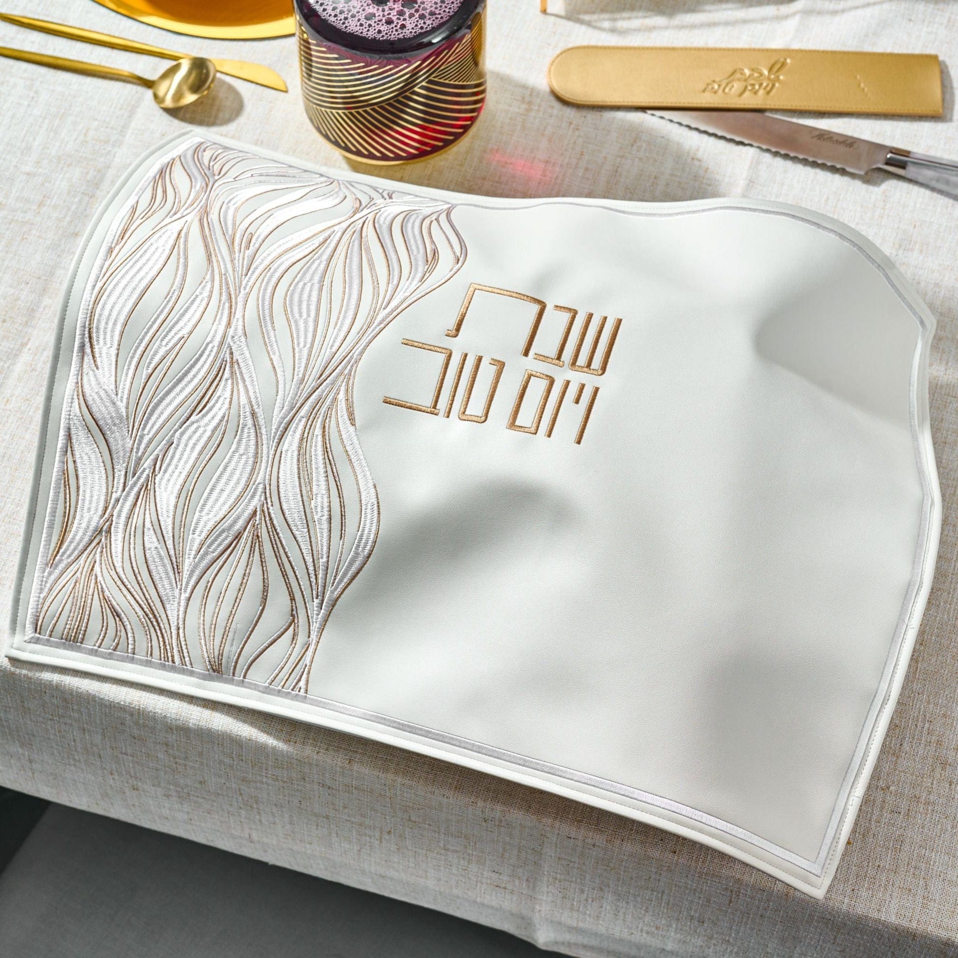 Lace Challah Cover on an elegant holiday table setting.