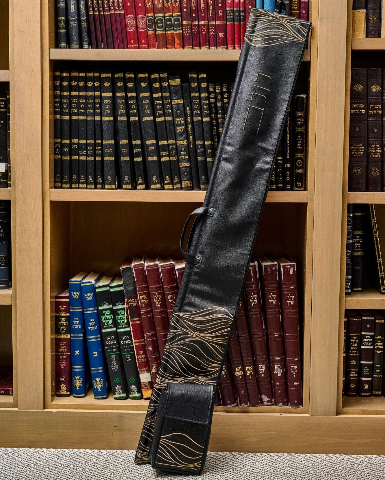 Lace Lulav and Esrog Case displayed in front of a wooden bookcase.