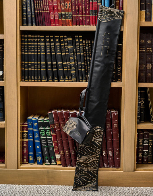 Lace Esrog Bag displayed in front of a wooden bookcase filled with Jewish sefarim.