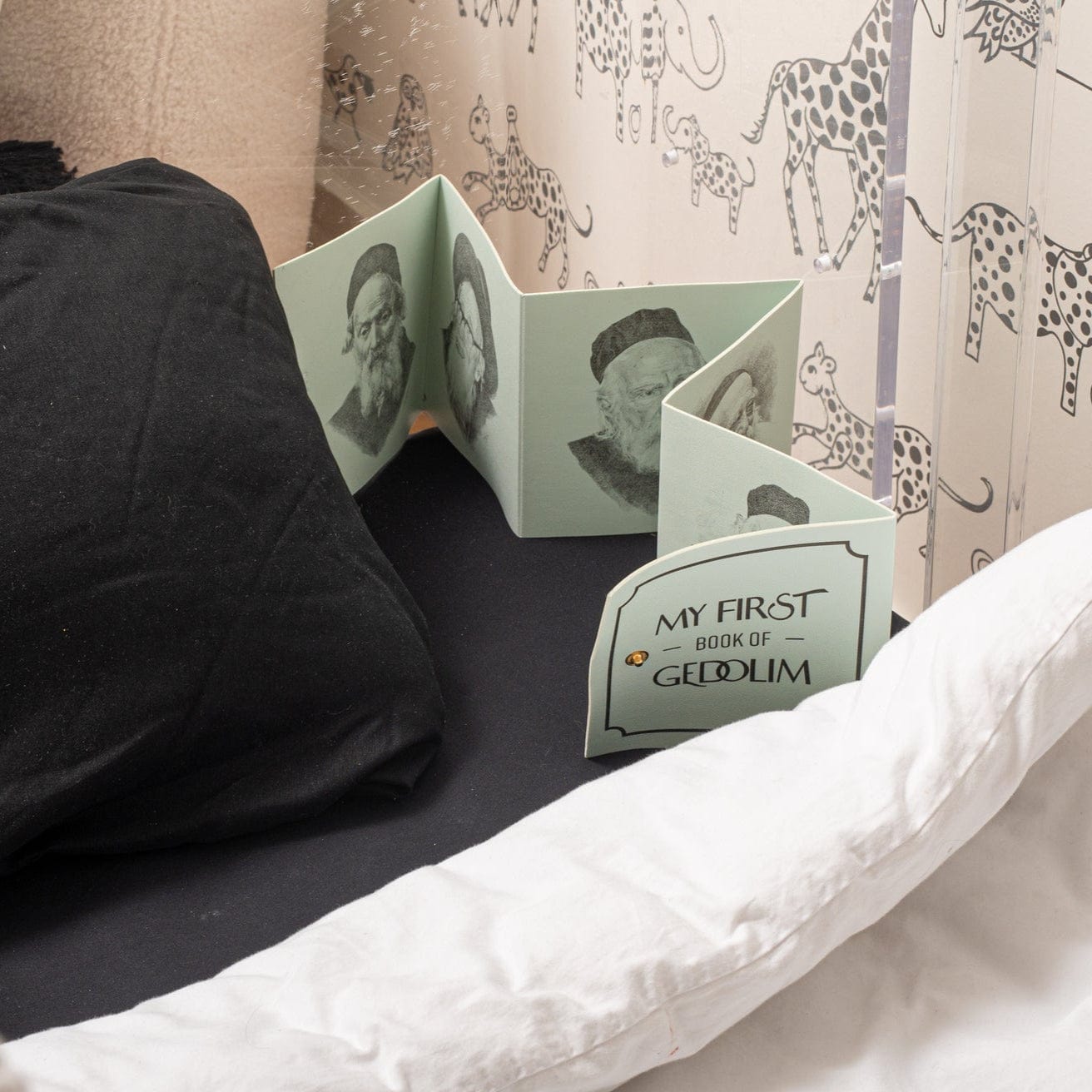 Leather Kids Gedolim Book on a bedside