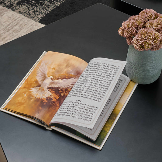 Gold Leather Painted Tehillim (Large) on a tabletop beside a flower vase | Waterdale Collection