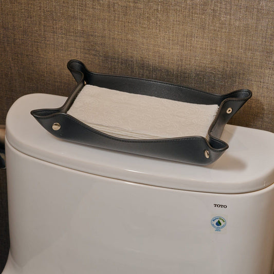 Black Leather Shabbos Toilet Paper holder displayed on a toilet tank in a modern bathroom