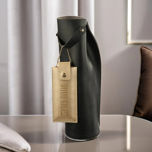 Black Leather Wine Bag with Mishloach Manos chocolate pouch on a table