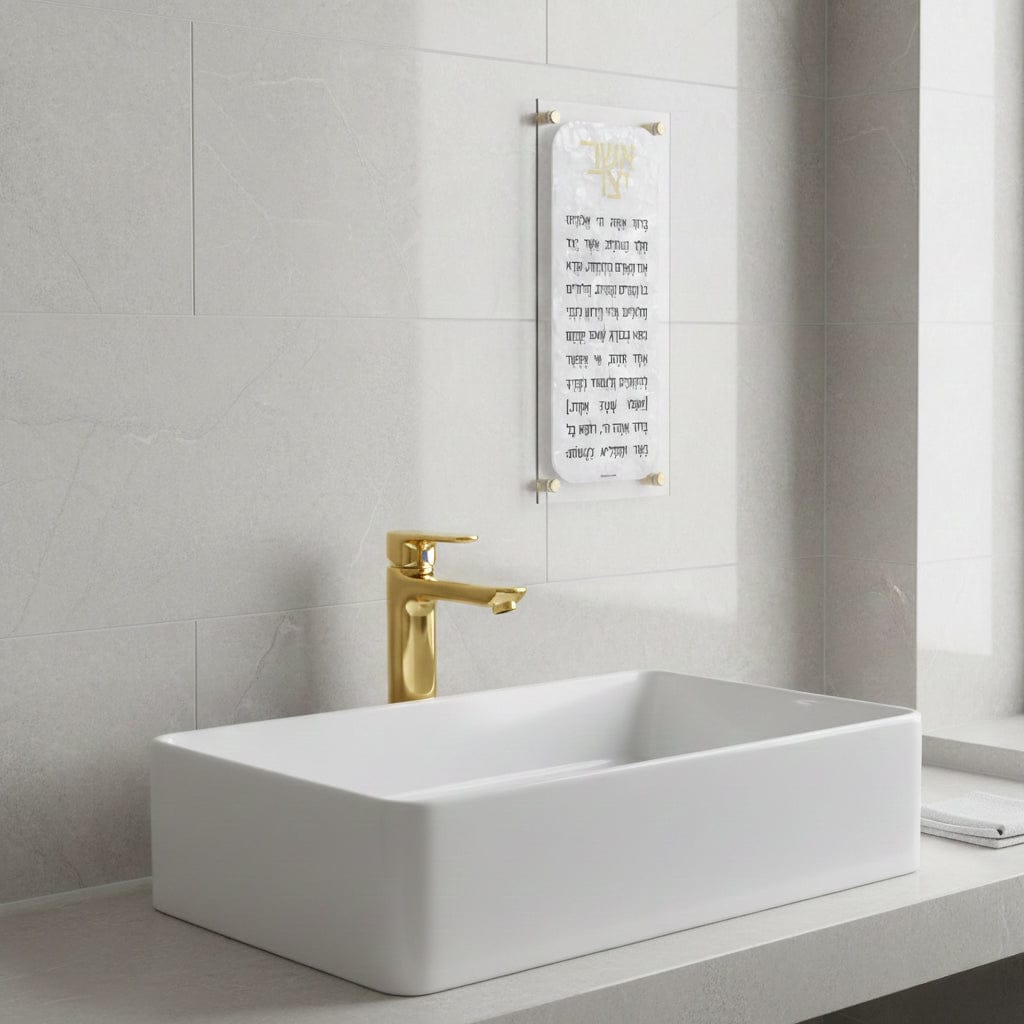 Pearl Marble asher yatzar hanging on the wall in a marble and gold bathroom - Waterdale Collection