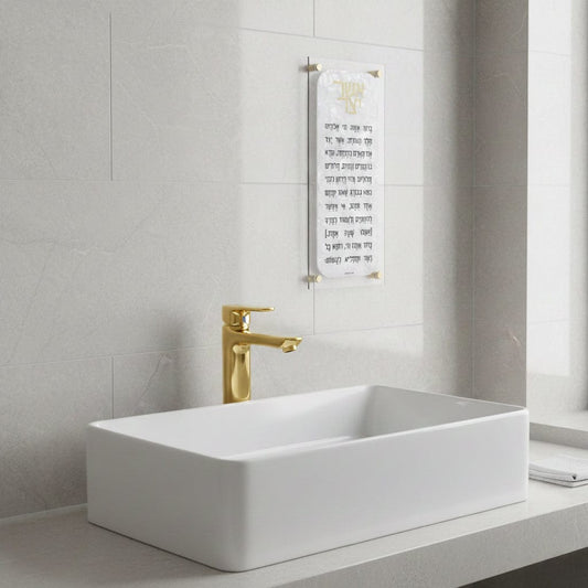 Pearl Marble asher yatzar hanging on the wall in a marble and gold bathroom - Waterdale Collection