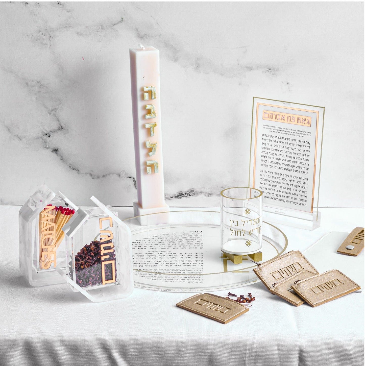Pearlstone Havdalah Set with tall candle, glass cup, spice box with matches, Hebrew blessing cards, and decorative tray on white background.