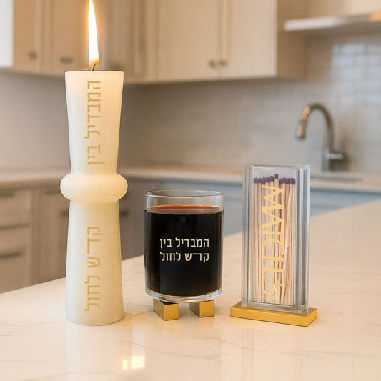 Elegant Havdalah set with Pillar Match Holder, glass of wine on a kitchen counter.