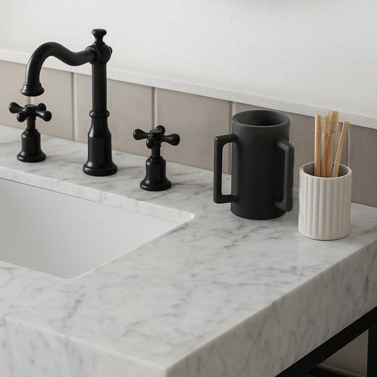 Matte black resin washing cup shown on a modern white marble bathroom vanity next to a black three-hole widespread faucet - Waterdale Collection