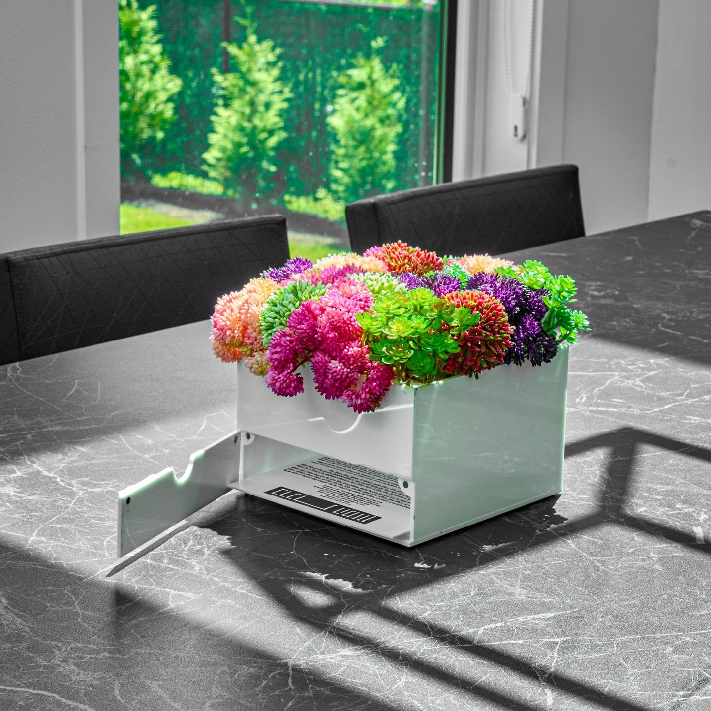 Small Succulent Pink Vase Bencher Set on a marble table.