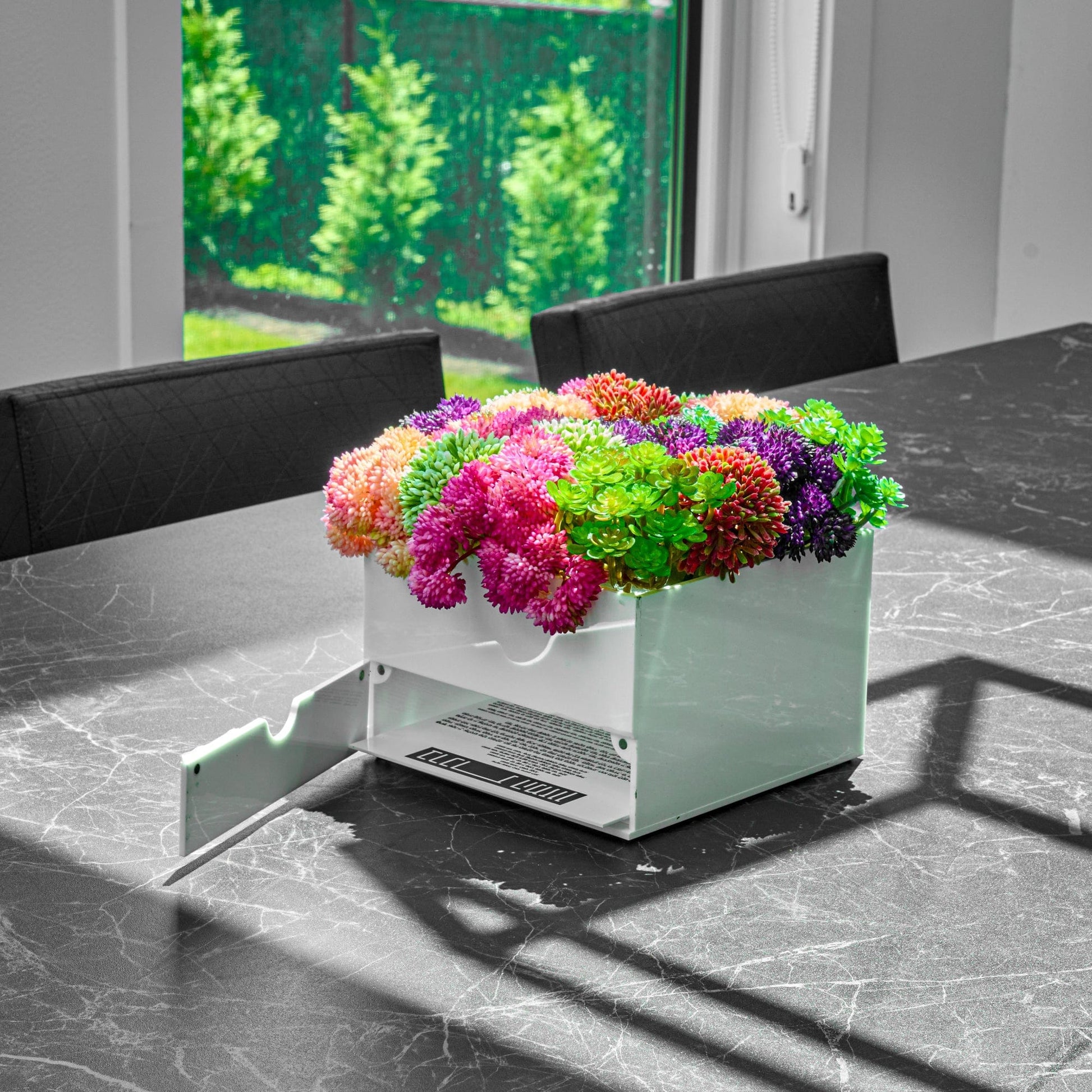 Small Succulent Pink Vase Bencher Set on a marble table.