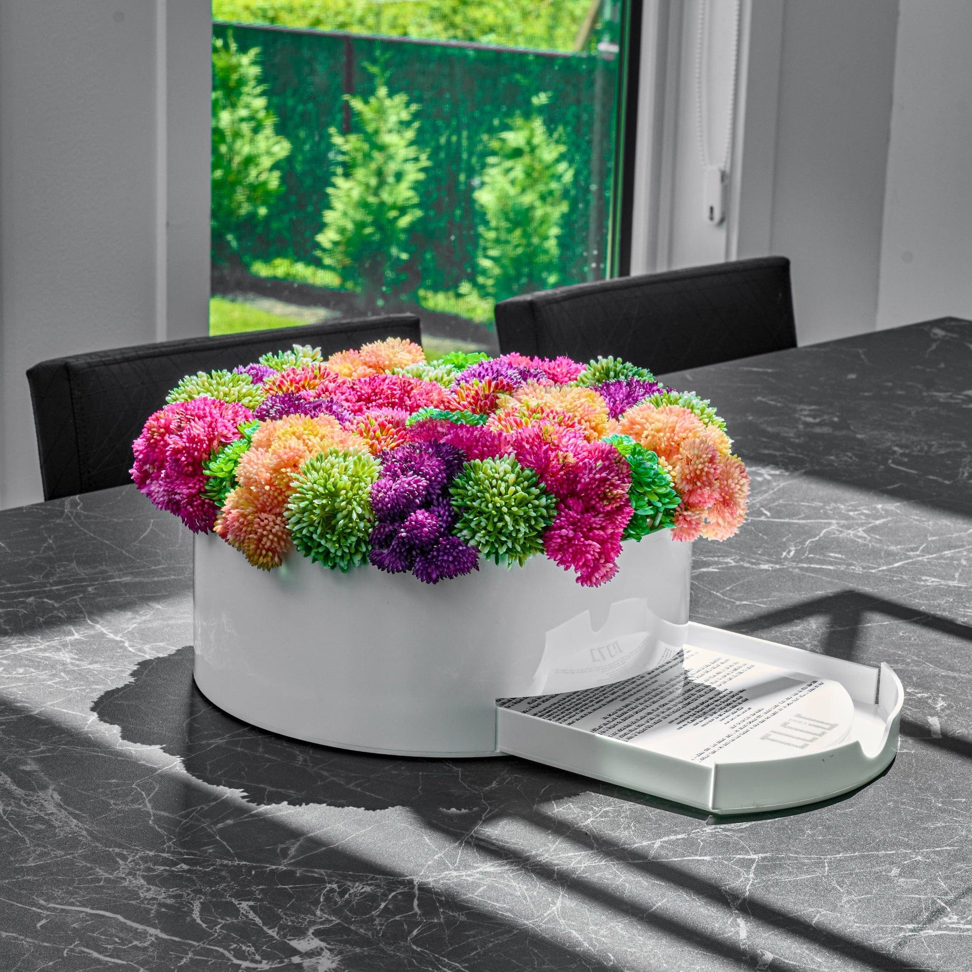 White Succulent Pink Round Vase Bencher Set on a dark marble table.