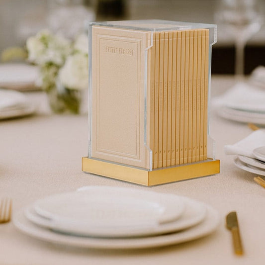 Tall Hardcover Leather & Lucite Bencher Set (Set of 14) on a formal dining table setting.