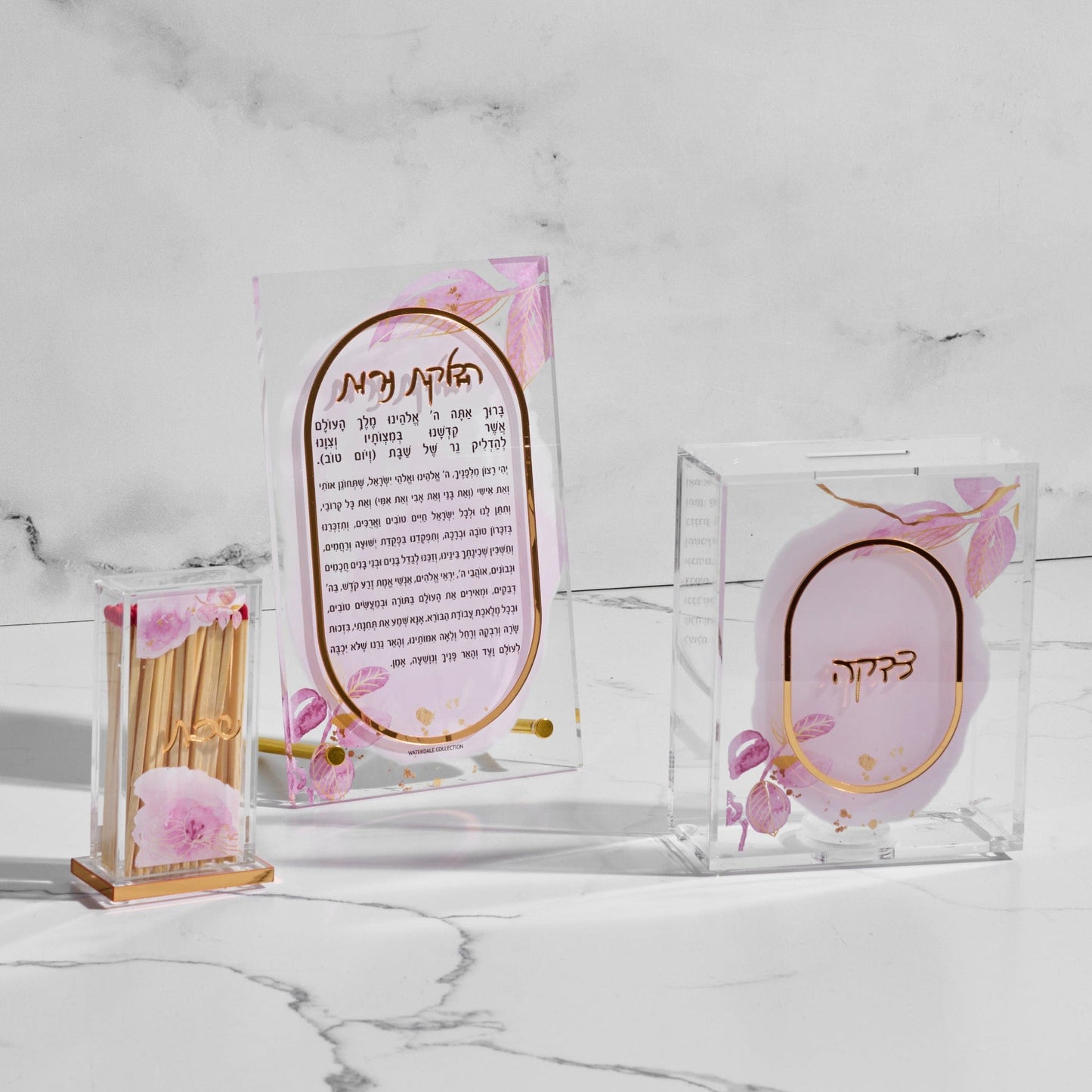 Watercolor Pillar Match Holder, including floral pink design, Hadlakat Nerot candle lighting prayer, and tzedakah box.