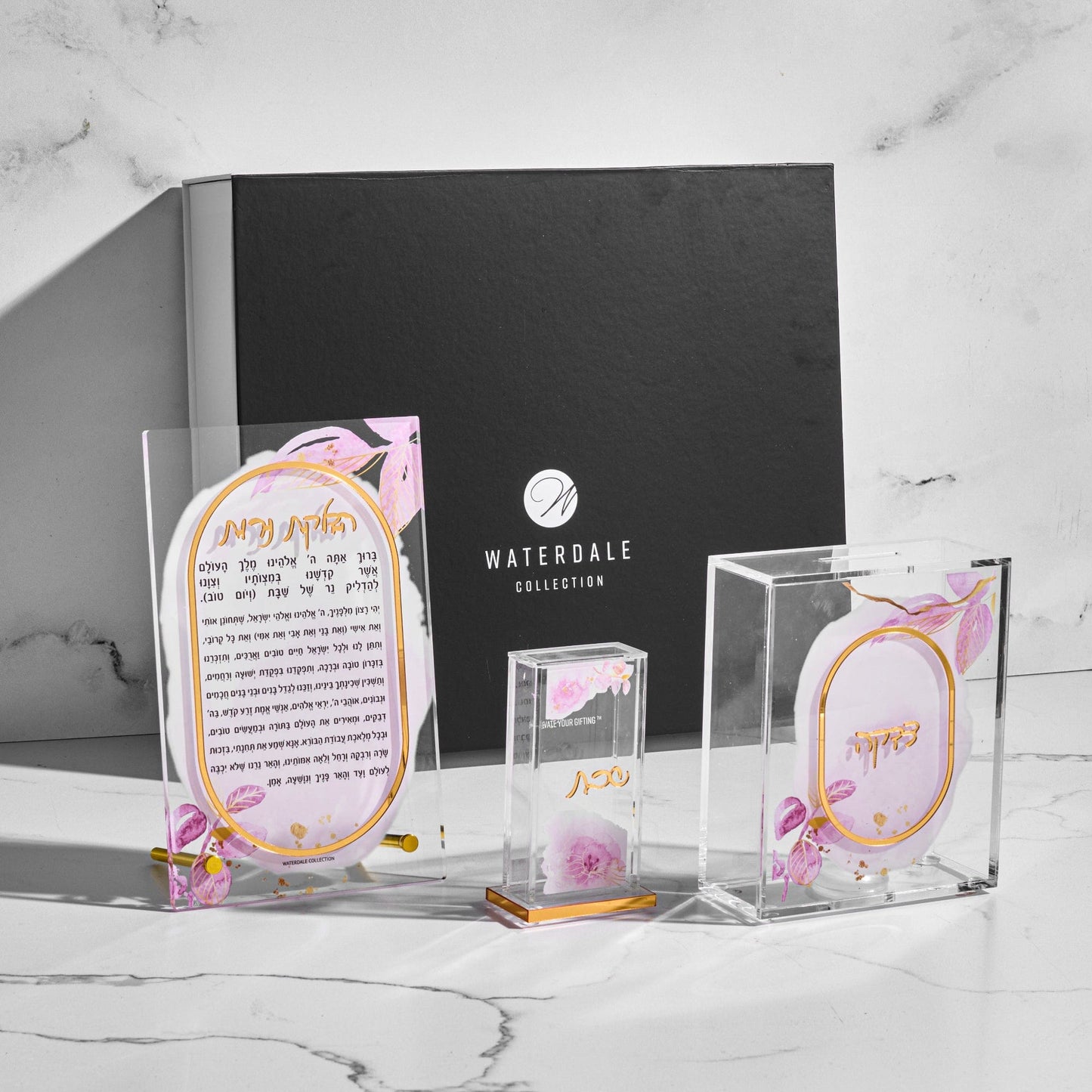 Watercolor Hadlokas Neiros Gift Box with floral pink acrylic Hadlakat Nerot prayer, tzedakah box, and match holder.