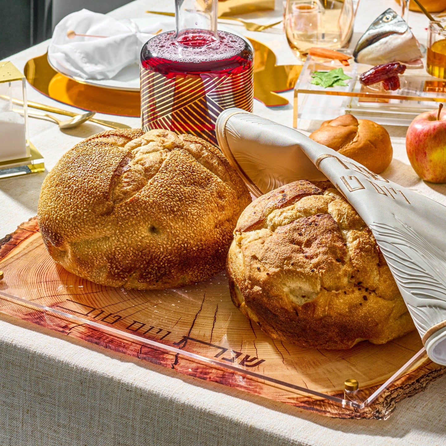Wooden Challah Board on a beautiful Shabbat table setting.