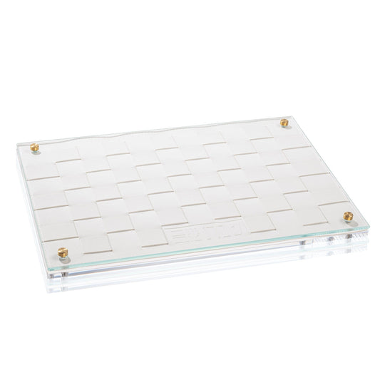 White woven challah board with glass top and brass accents, featuring an elegant embossed Hebrew design.
