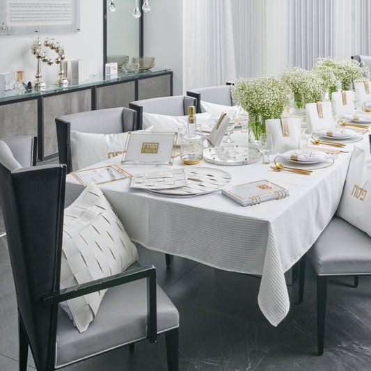 Woven Leather Pesach Set displayed on a beautifully arranged Seder table.